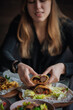 © eduardpopik - woman in a restaurant eat shawarma
