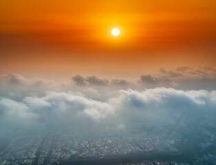 Wall Mural - the background of the morning sunrise from the air with the clouds and the rising sun is very impres