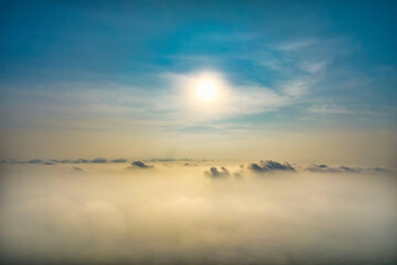 Wall Mural - the background of the morning sunrise from the air with the clouds and the rising sun is very impres