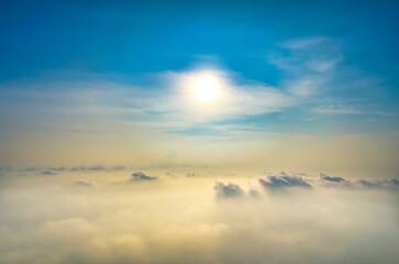 Wall Mural - the background of the morning sunrise from the air with the clouds and the rising sun is very impres