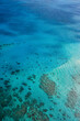 © Jina Ihm - An aerial view of the coral reefs, white sand bars and cays, and clear turquoise waters of the Great Barrier Reef — Coral Sea, Cairns; Far North Queensland, Australia