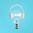 Closeup Lighting bulb Floating put on headphones isolate on blue color background. Minimal idea concept. 3D Render.