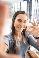 Poster - Selfie, portrait and business woman with ok sign for success, agreement and perfect emoji in office. Picture, smile and happy female worker with hand gesture for okay, good job and yes icon at desk