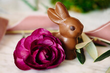 Close-up Of Easter Bunny With Rose On Table
