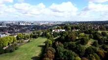 Beautiful Panoramic Skyline Aerial Overviewing Greenwich, Thames And London City, United Kingdom. Cloudy Sunny Day.