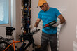 Young man repairing bicycle and removing grips with dressing dryer