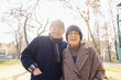 © Westend61 - Smiling senior man with woman at autumn park