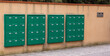 Bank of letter boxes outside the entrance to a block of flats