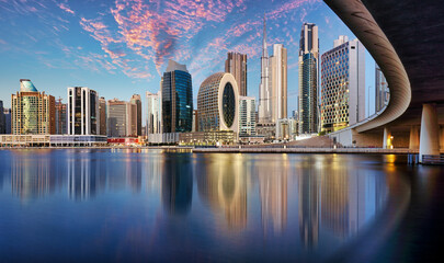 Wall Mural - Panaroma of Dubai skyline with Burj khalifa and other skyscrapers at night from Al Jadaf Waterfront; UAE