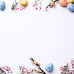 Wall Mural - Border with Easter composition with spring flowers and colorful quail eggs over white background. Springtime and Easter holiday concept with copy space. Top view