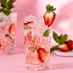 Wall Mural - Fresh limonate with crushed ice, strawberry and mint on pinkbackground. Summer cold drink concept with copy space