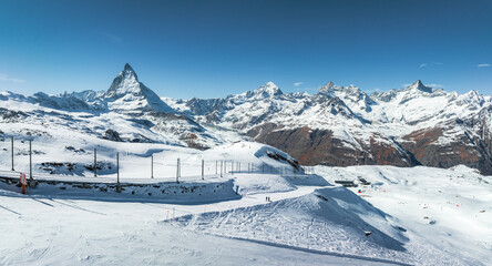 Wall Mural - Beautiful Zermatt ski resort with view of the Matterhorn peak on the horizon. Beautiful Swiss Alps.