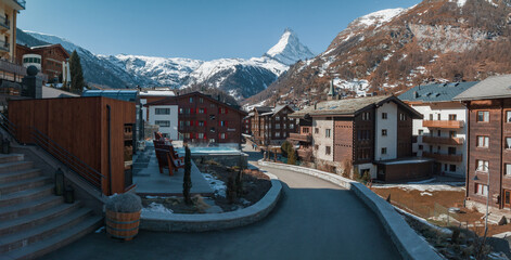 Aerial view on Zermatt Valley town and Matterhorn Peak in the background in the morning in Switzerland. Magical Swiss town with no cars and electric trains going up the mountains.