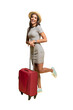 Woman traveler with suitcase on transparent background