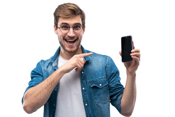 Poster - Portrait of a cheerful young man in jeans t-shirt isolated over transparent backgound, showing blank screen mobile phone