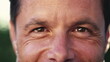 © Marco - Macro eyes of a happy man looking at camera. Close up of male 40s middle aged person smiling with wrinkles. Person eyesight vision closeup