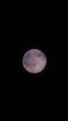 Wall Mural - Magical full moon at night. Telephoto view of mysterious clouds flying against the bright full moon. Real midnight footage with black background and copy space. Creepy halloween sky, astrology concept