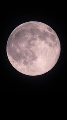 Wall Mural - Magical full moon at night. Telephoto view of mysterious clouds flying against the bright full moon. Real midnight footage with black background and copy space. Creepy halloween sky, astrology concept