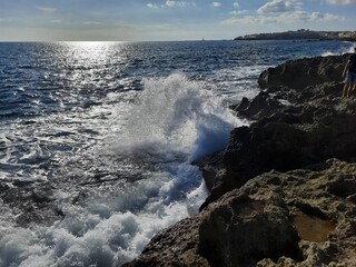 waves crashing on rocks