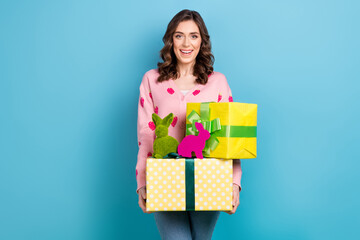 Poster - Photo of excited girl wear pink print cardigan hold many gifts family tradition easter holiday event celebration isolated on blue color background