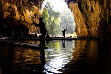 Tourists In Silhouette Ferried On Bamboo Rafts Inside The Tunnel River Within Tham Nam Lod Caves, Mae Hong Son Province, Thailand.
