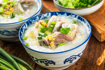 Wall Mural - Chinese cuisine: a bowl of delicious fish porridge