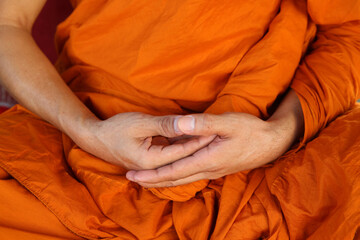 Wall Mural - Monk meditating in Wat Trahimit, Bangkok. Thailand.