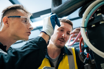 Wall Mural - Multiracial tachnicial engineer training with robot arm