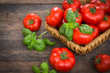 Fototapeta Kuchnia - Fresh ripe tomatoes and basil on the wooden table
