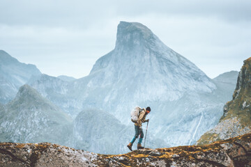 Wall Mural - Man hiking in Norway mountains travel with backpack outdoor active vacations healthy lifestyle extreme sports exploring Lofoten islands