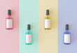 Cosmetic glass bottles on pastel stripes table template for package design, top view. Perfume spray bottles mockup, colorful glass with liquid. Pink, green, blue, yellow color. 