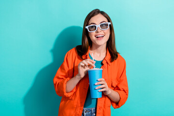 Sticker - Photo of lovely cute girlfriend wear orange trendy clothes interested look empty space tickets sale isolated on cyan color background