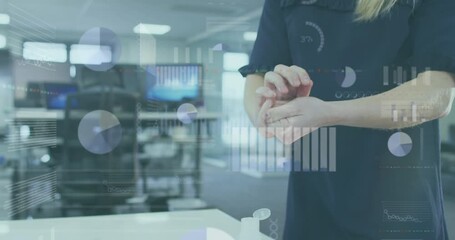 Poster - Animation of financial data processing over caucasian businesswoman disinfecting hands in office