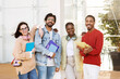 © Prostock-studio - Cheerful young international people students in casual with headphones, notebooks, study, enjoy spare time