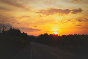 Wall Mural - asphalt road at sunset