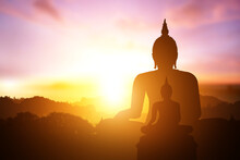 Silhouette Of Buddha On Mountain In Sunset Light