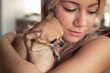 © Cavan Images - Close-up of teenage girl carrying Chihuahua dog