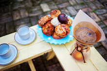 High angle view of coffee with desserts on wooden table at backyard