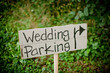 © Cavan Images - Wedding parking text on wooden plank at field