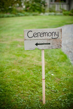 Ceremony Text On Wooden Plank At Field