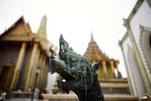 Close-up Of Dragons Sculpture Against Wat Phra Kaew At Grand Palace