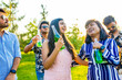 © yurakrasil - indian students having a lunch in Delhi park outdoors