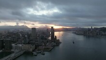 Colorful Sunrise On A Cloudy Morning. Tsim Sha Tsui, Hong Kong. Drone Panning Shot