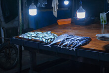 A Table Of Fish And Other Seafood On Counter Of Market
