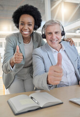 Canvas Print - Customer support, thumbs up and portrait of black woman and man happy at desk in office. Contact us, help desk and teamwork with smile and notebook at advisory agency for crm training at call center.