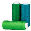 Spools with green and turquoise thread for sewing, craft supply, isolated object 
