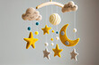 © Oleksandr - Baby crib mobile with smiling clouds moon stars and clouds. handmade children's toys over the bed for newborns. Eco-friendly toys made of felt and wood hanging in a bright room. Generative AI