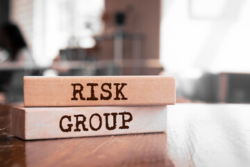 Wall Mural - Wooden blocks with words 'RISK GROUP'.