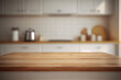 © slonme - Empty wooden tabletop with blurred kitchen background. Mock up for display or montage of product. Blur kitchen counter background for montage product display for visual layout. AI generated image