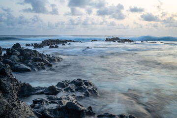 Wall Mural - Oceanscape during the sunset with waves and rock, Ascension island.